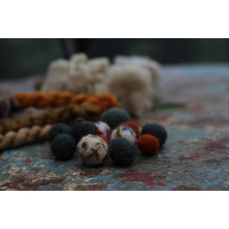 Felt bead making kit with vintage wool yarn, natural dye flowers and silk cord in glassine packaging