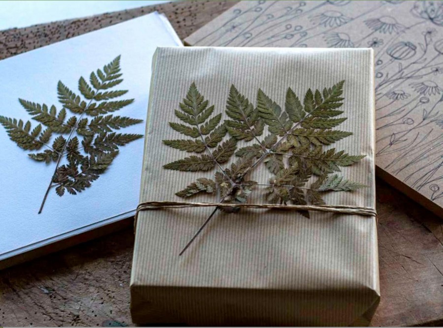 natural gift wrap brown paper and pressed leaves